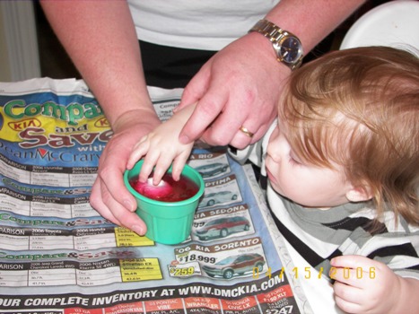 Abby dyeing eggs