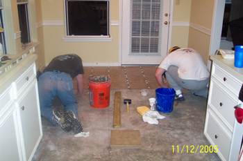 Terry and Tim laying tile in the breakfast room