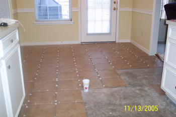 Tile in the breakfast room (note the walking path they left me!)